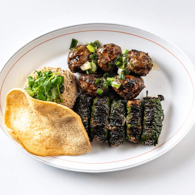 Combo Platter/Bò Nướng Lá Lốt (5 pieces), Bò Nướng Mỡ Chài (5 pieces), Bò Cha Dùm (1 piece), Bánh Phồng Tôm (1 piece).